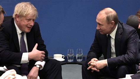 Russias President Vladimir Putin And Britains Prime Minister Boris