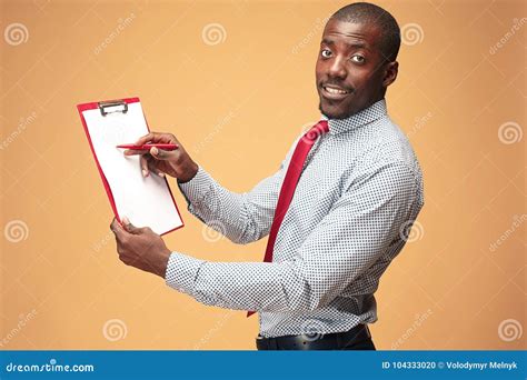 Attractive Standing Afro American Businessman Writing Notes Stock Photo