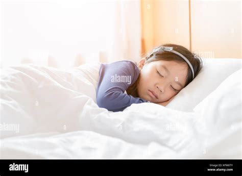 Cute Asian Girl Sleep In White Blanket Healthy Concept Stock Photo Alamy