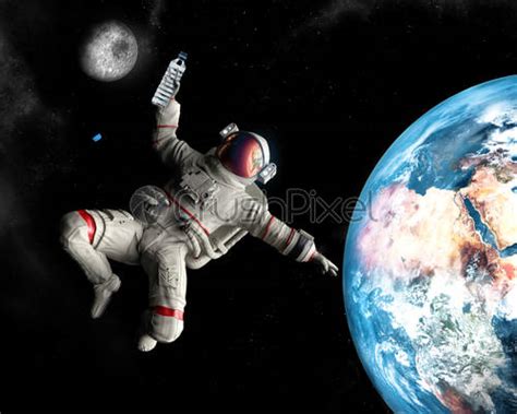 Astronaut Floating In Outer Space Stock Photo Crushpixel