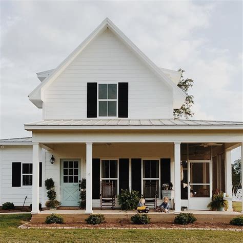 Help sell your home by selecting a front door that makes your while they are standing at your front door and getting the keys out, give them reasons to generate i own a condo and its white with black shutters, what color would go? White farmhouse, gray metal roof, black shutters, open ...