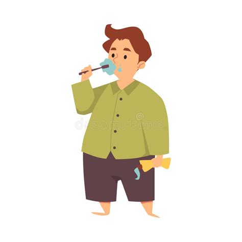 Kid Boy In Pajamas Brushes Teeth With Tooth Brush Holding Toothpaste In