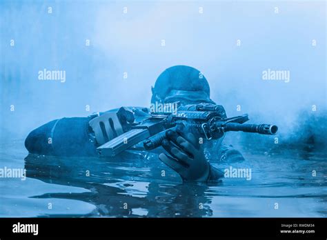 Frogman With Complete Diving Gear And Weapons In The Water Stock Photo Alamy