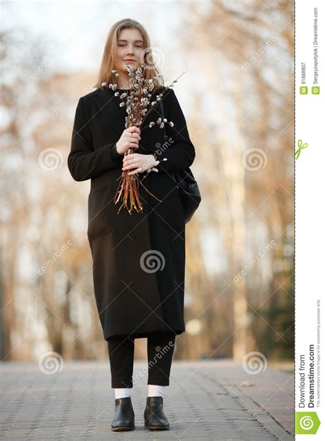 Emotional Portrait Of Young Happy Beautiful Woman With A Bouquet Of