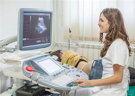 Doctor Performing An Ultrasound Exam By Stocksy Contributor Mosuno