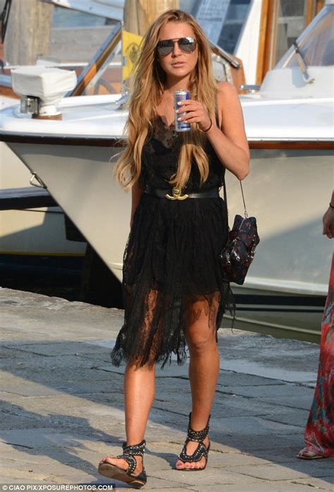 Leggy Lindsay Lohan Shows Off Her Sun Kissed Pins In A Black Lacy Dress