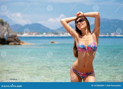 Beautiful Woman In Bikini And Sunglasses On Sea Background Sea Coast