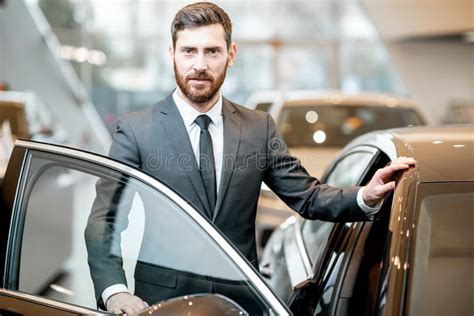 Businessman Portrait Near The Car In The Showroom Stock Photo Image