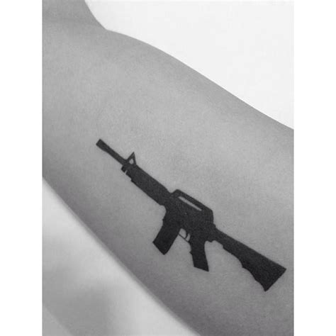 Minimalistic Style Rifle Tattoo Done On The Inner Arm