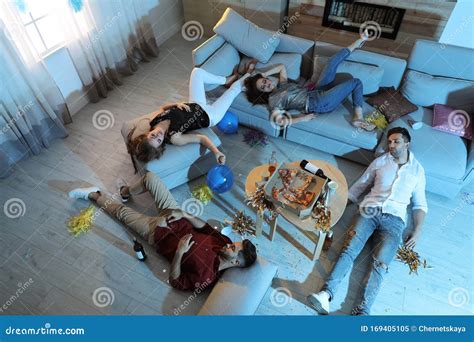 Drunk Friends Sleeping In Messy Room After Party Stock Image Image Of