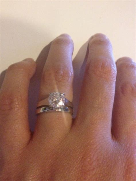 Am i supposed to get a ring with a band because i the engagement ring is a fancy thing to show everyone how much your new fiance cares. Wedding and engagement rings that don't sit flush together?