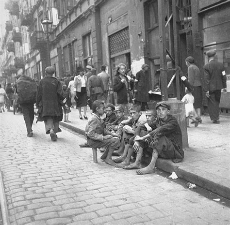 A Group Of Destitute Boys On A Curb In The Warsaw Ghetto Collections