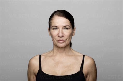 Portrait Of Serious Mature Woman Wearing Black Top Stock Photo