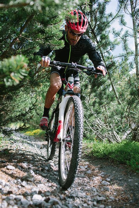 Man Riding A Mountain Bike By Stocksy Contributor Davide Illini Stocksy