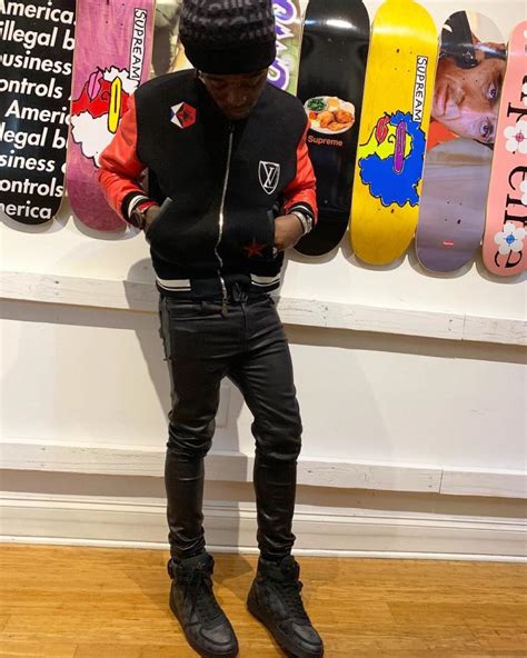 Lil Uzi Vert Wearing A Louis Vuitton Varsity Jacket And High Top Sneakers