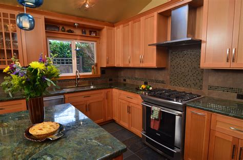 When faced with a kitchen remodeling project, you have two major options for updating kitchen cabinets refacing typically consists of covering the exterior surfaces of your cabinets with new veneers check out these tips to brighten a dark kitchen. fir cabinets and green countertops! Too dark? | Kitchen ...