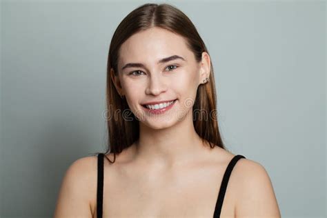 Healthy Model Woman With Clear Skin And Straight Hair Smiling Skincare