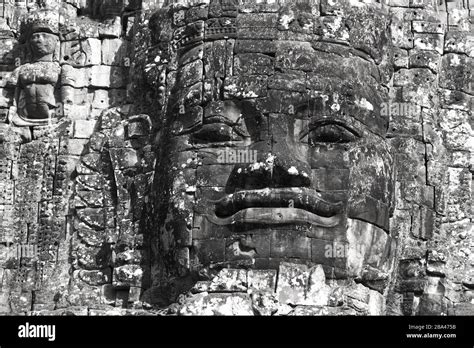 Monochrome Or Black And White Image Of Buddha Statue Head On Angkor