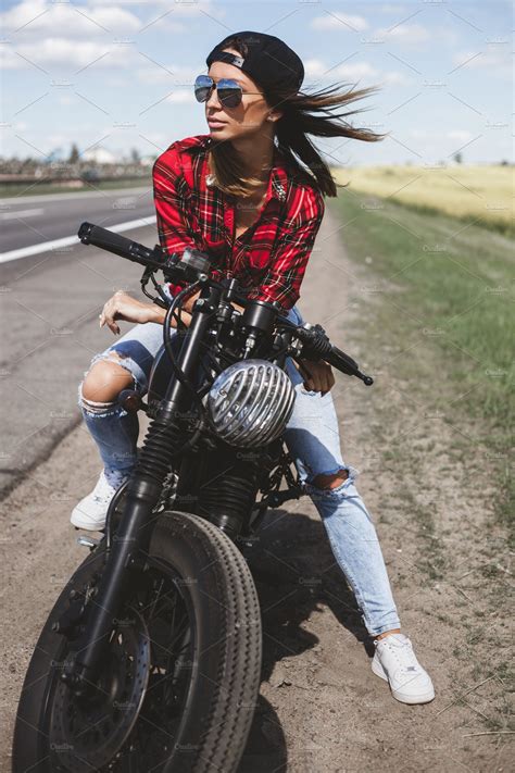 biker girl sitting on motorcycle high quality people images ~ creative market