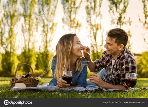 Happy Couple Making A Picnic — Stock Photo © Ikostudio 162744778