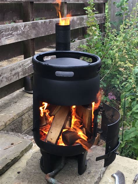 Homeowners can use them to build a fire pit that burns gas, firewood and charcoal. Pin by Michael Locke on Stoves | Gas bottle wood burner ...