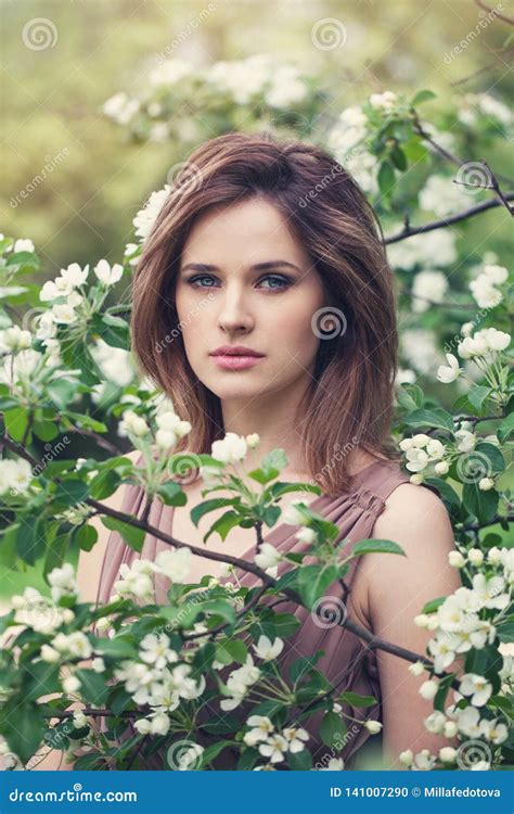 Portrait Of Sensual Woman In Spring Blossom Garden Natural Beauty