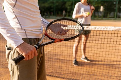 Free Photo Close Up Man Holding Tennis Racket