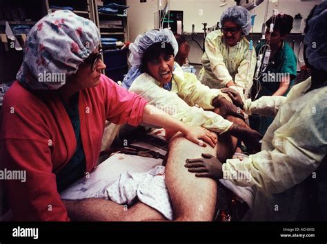 Doctors And Nurses Treat A Gunshot Victim In The Emergency Room Of A Public Hospital Photo By