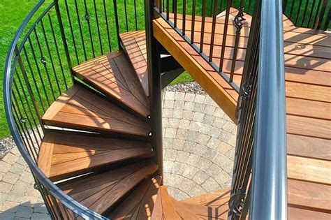 They use a much smaller foot print, in terms of space used, and are much more attractive than a regular outdoor stairwell. Combination wood and iron spiral staircase case | Deck ...