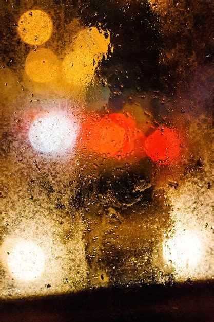 Premium Photo Rain Drops On Window With Blurry Background With Bokeh