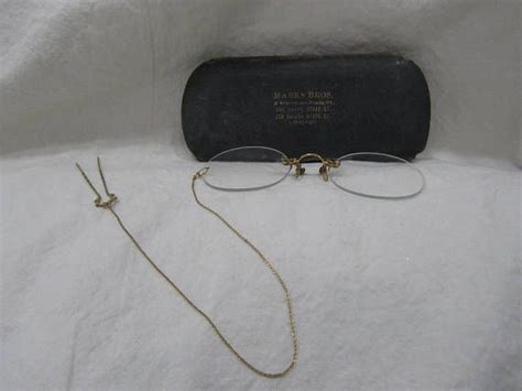 vintage pince nez spectacle glasses with chain and hairpin clam made by marks bros history
