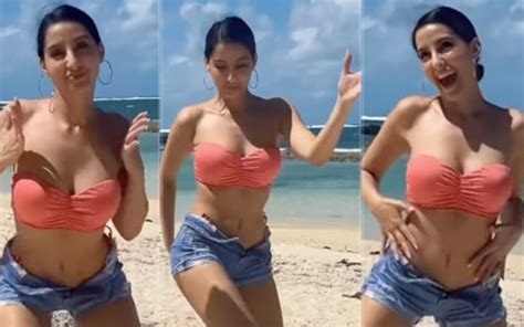 Viral Nora Fatehi Dance Moves Set Instagram On Fire Diva Groves By The Beach In Pink Swim Set