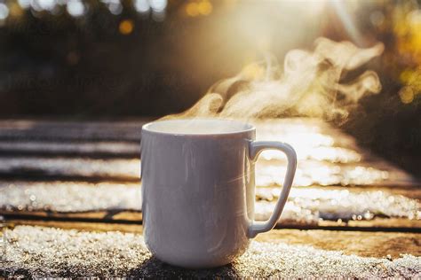Steaming Coffee Mug In The Cold By Stocksy Contributor Evan Dalen