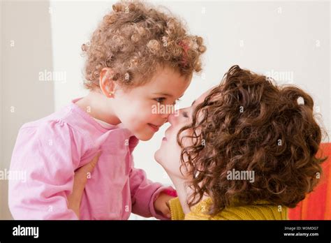 Mother And Daughter Face To Face Stock Photo Alamy