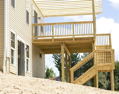 How much should a deck be sloped to prevent water pooling? How to Build a Roof Over My Existing Deck - Costs, Designs