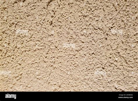 Texture Of Rough Beige Stucco Wall Decorative Plaster On The Wall