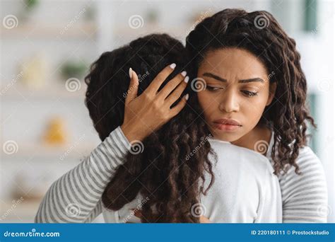 Worried Young Black Mother Comforting Her Crying Daughter Stock Image