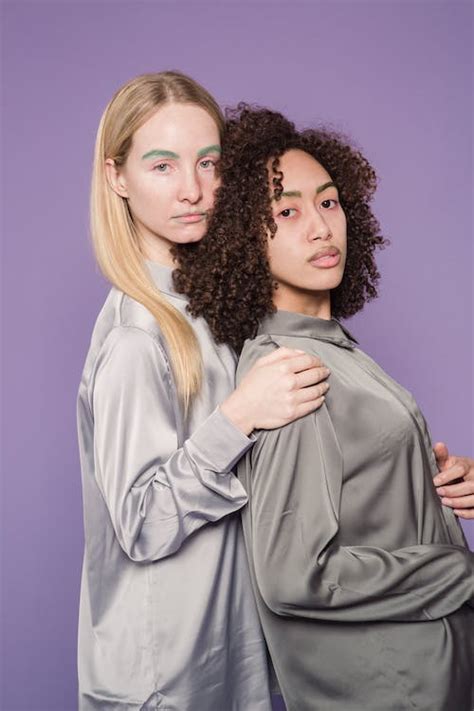 Serious multiracial ladies looking at camera in studio · Free Stock Photo