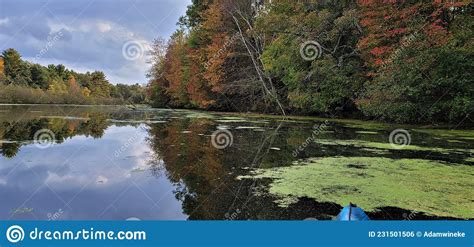Kayak On Mirror Lake Fall Colors Reflecting In The Water Stock Photo