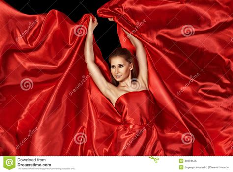Beautiful Woman In Red Silk Dress Flying Stock Image