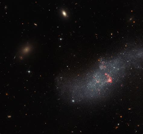 Hubble Sees A Diminutive Dwarf Galaxy Without A Defined Structure