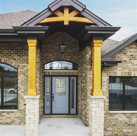 Stained Wood Beams And A Gable Pediment Lend A Cohesive Rustic Element