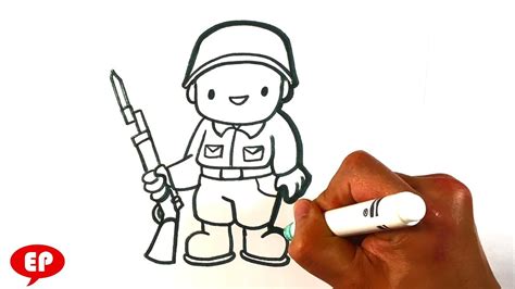 A Hand Holding A Marker And Drawing A Soldier