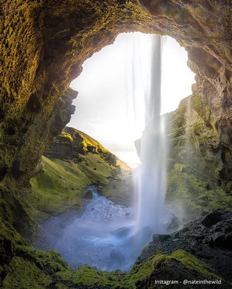 Sight From The Interior Of A Cave Behind A Waterfall Looks Like The