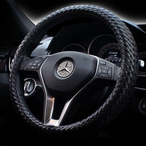 The Steering Wheel Cover Is Made Out Of Leather And Has A Braided