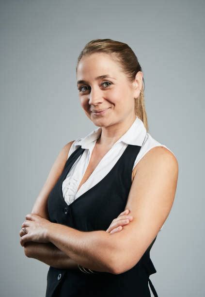 Smug Young Business Woman With Arms Crossed Stock Photos Pictures