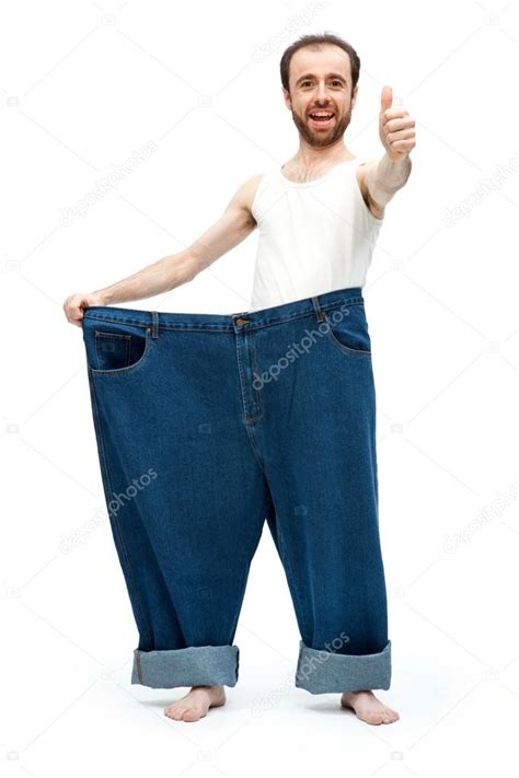 Funny Slim Man With Large Pants Jeans Isolated On White Stock Photo By