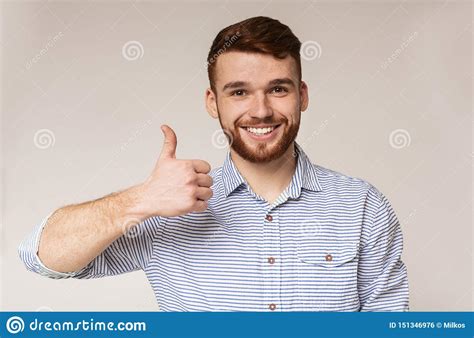 Young Man Showing Thumb Up And Smiling On Camera Stock Photo Image Of