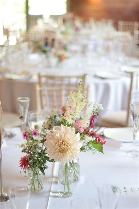 Simple table centrepieces with cafe au lait dahlias and meadow style