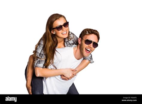 Smiling Young Man Carrying Woman Stock Photo Alamy